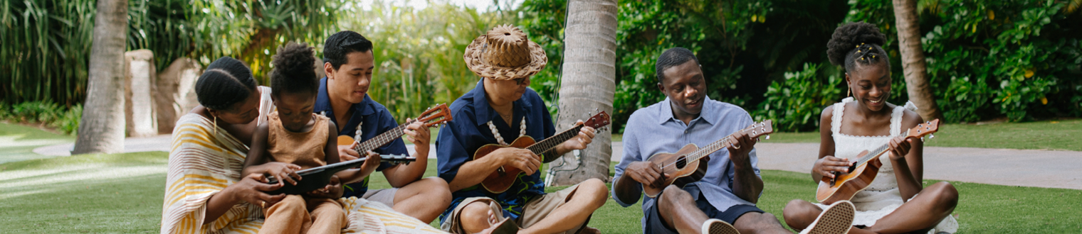 Image of family with ukeleles and guitars