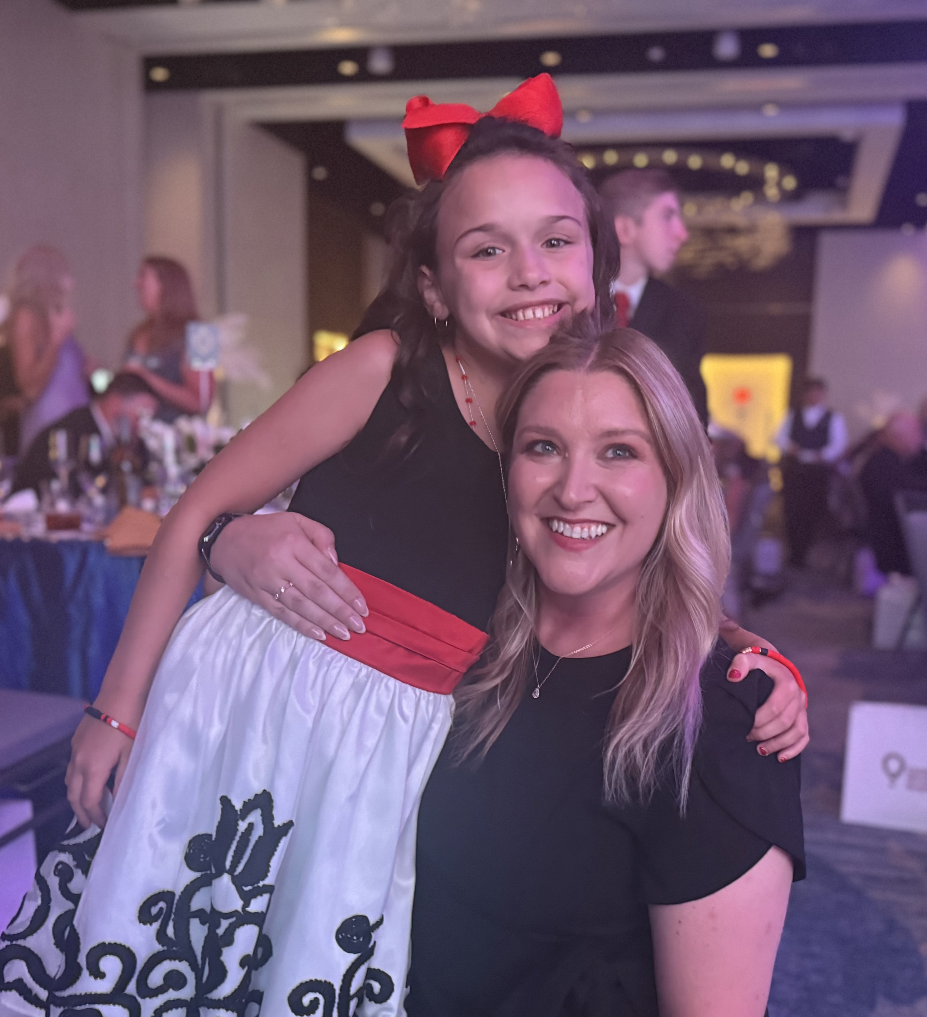 Children's Miracle Network spotlight child at gala with Partners employee