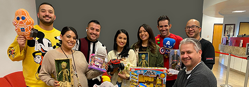 Group of people holding toys