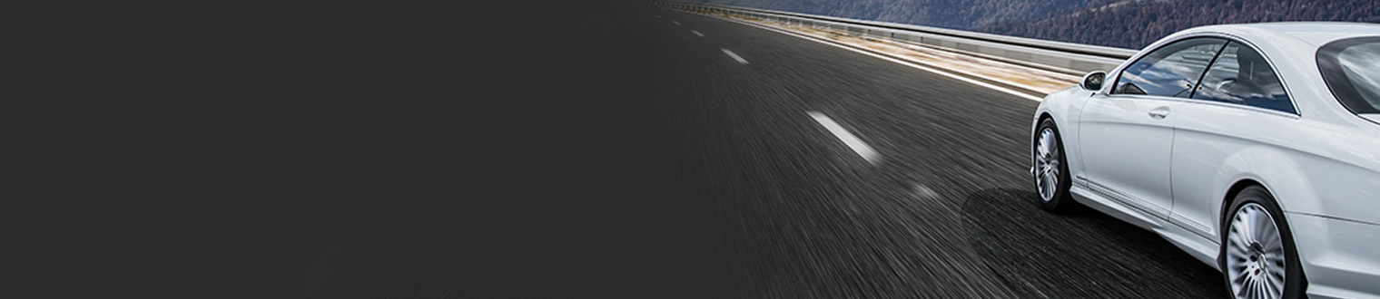 car on road next to mountains