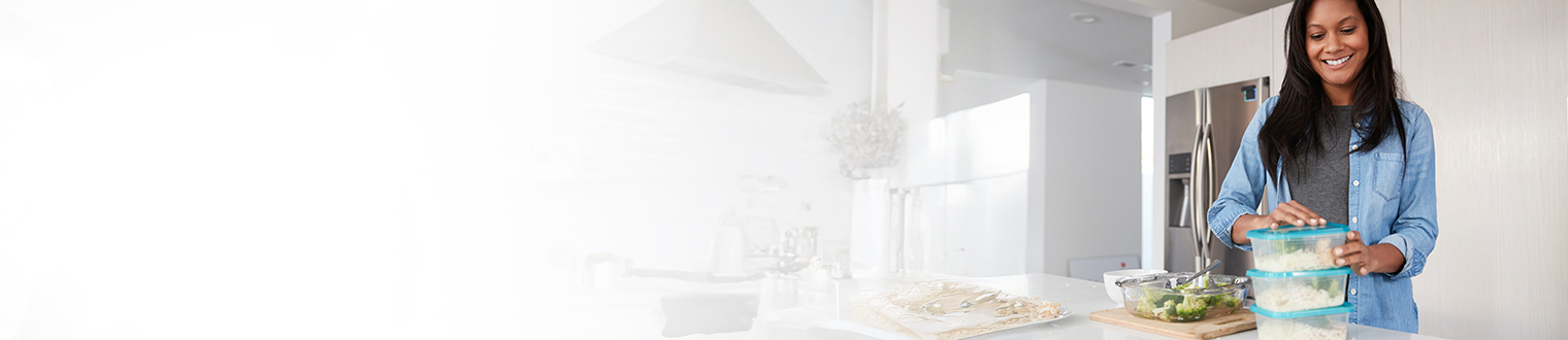 woman meal prepping in kitchen