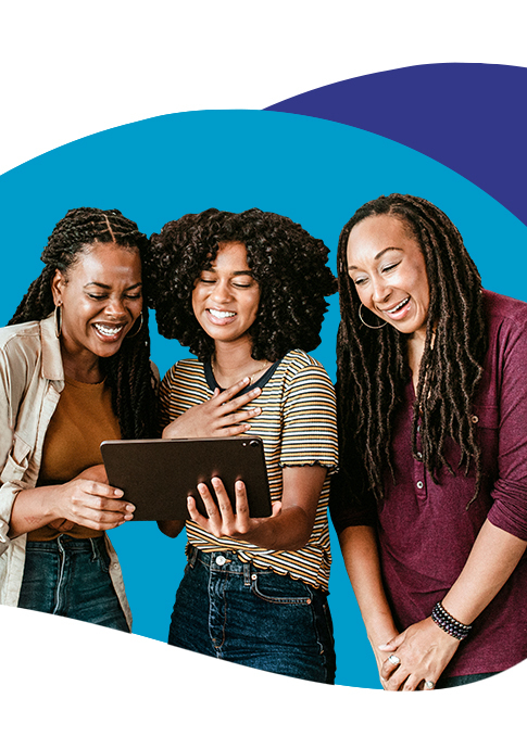 Three women looking at a tablet