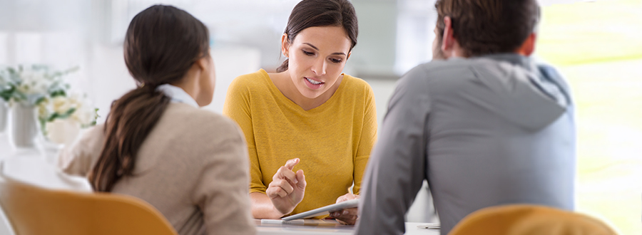 woman talking with a couple