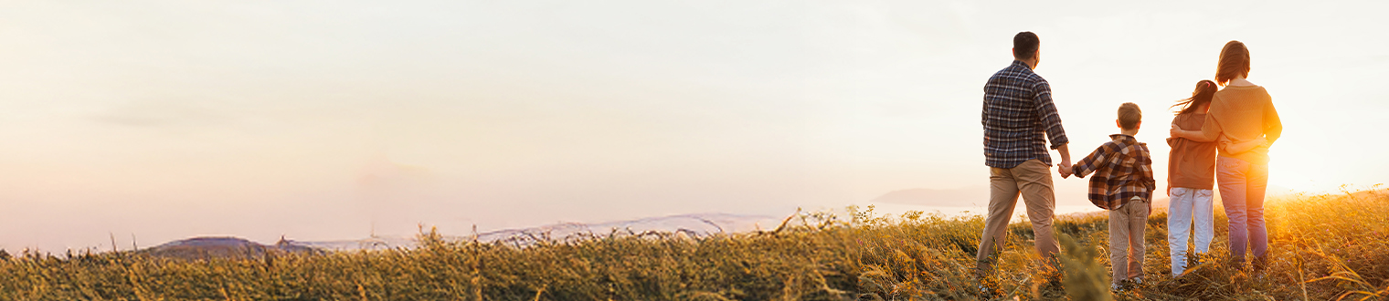 family overlooking the sunset