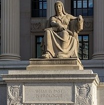 sitting down lady statue