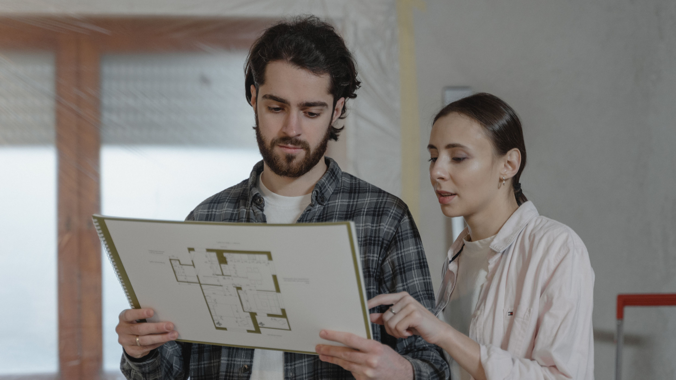 couple looking at floor plans