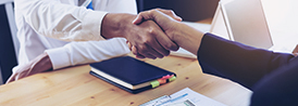 hands extending a handshake